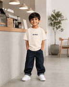 Boys oversized graphic t-shirt in off-white, Be Kind print, Bold Cub Korean streetwear - lifestyle shot