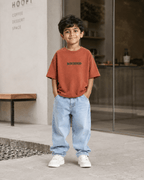 Boys oversized graphic t-shirt in terracotta, Good Kid Bad Ideas print, Bold Cub Korean streetwear - lifestyle shot