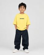 Boys oversized graphic t-shirt in pastel yellow, Good Kid Bad Ideas print, Bold Cub Korean streetwear - front