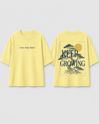 Boys oversized graphic t-shirt in pastel yellow, Keep Growing print, Bold Cub Korean streetwear - flat lay