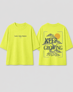Boys oversized graphic t-shirt in neon lime, Keep Growing print, Bold Cub Korean streetwear - flat lay