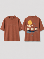 Boys oversized graphic t-shirt in Brown, Stay Curious print, Bold Cub Korean streetwear - flat lay