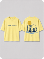 Boys oversized graphic t-shirt in pastel yellow, Stay Curious print, Bold Cub Korean streetwear - flat lay